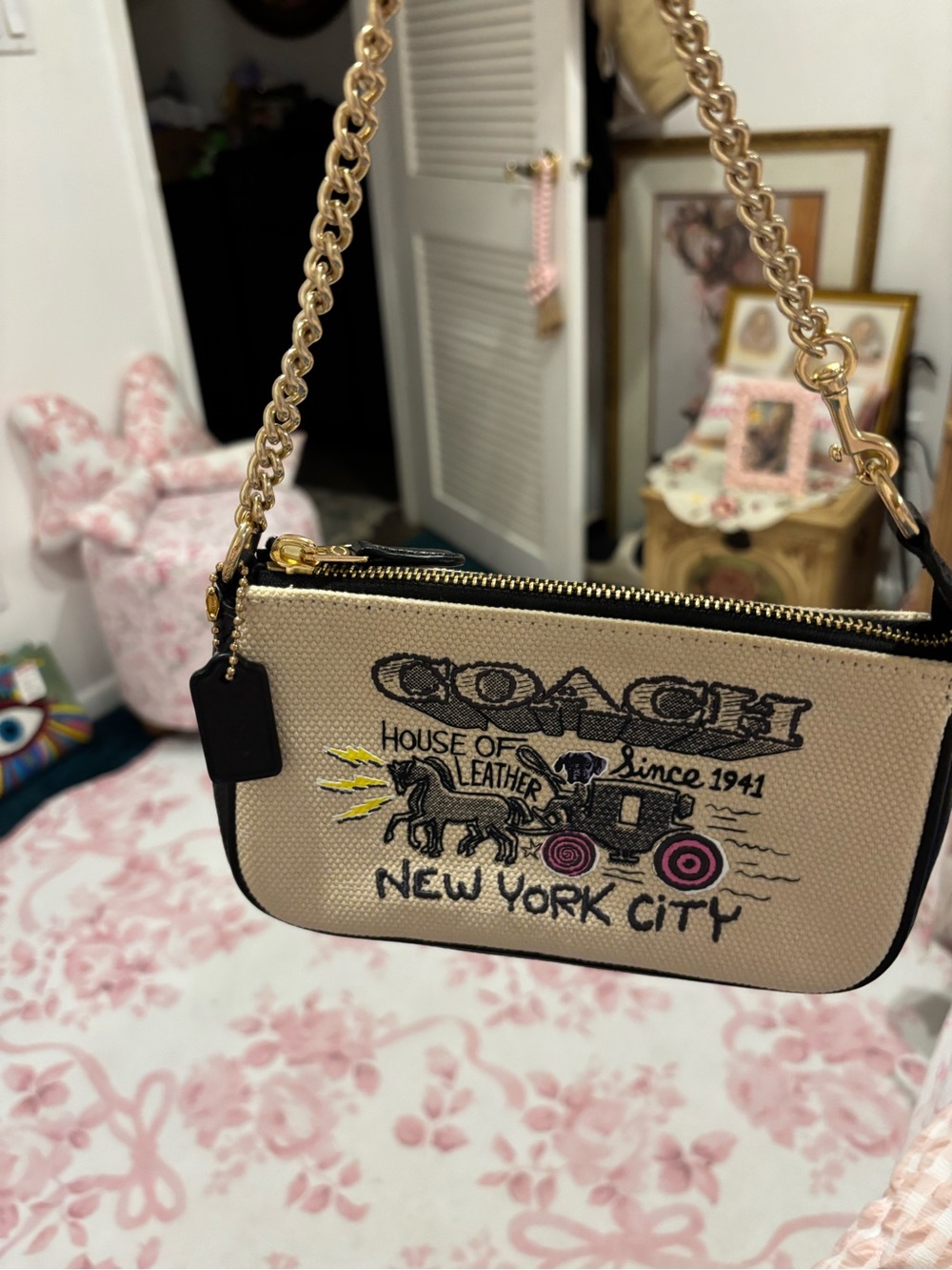 Coach Beige Canvas Pouch with Black Trim and Pink Wheel Accents